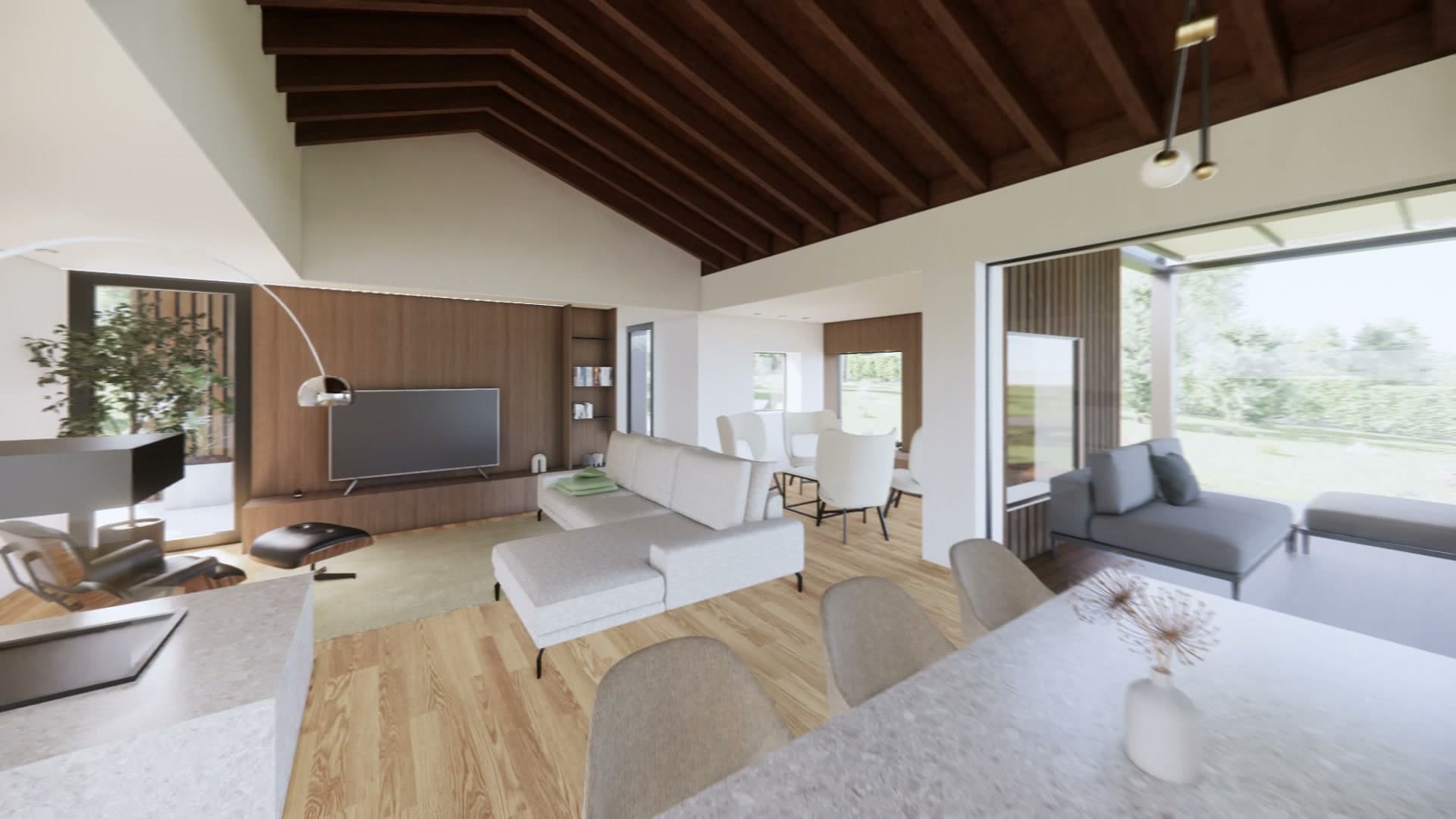 Zona giorno di Villa Horizon con divano, tavolo e vetrata sul giardino